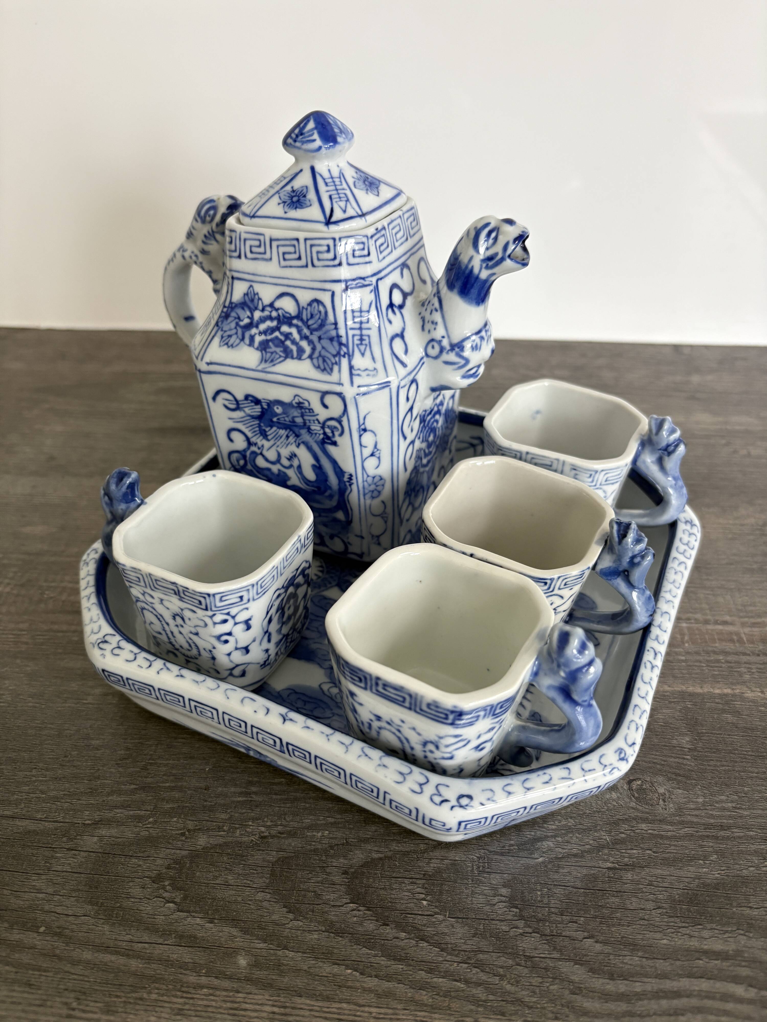 Antique Chinese tea set decorated with dragons.