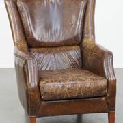 Fauteuil en cuir de vachette grainé au design intemporel