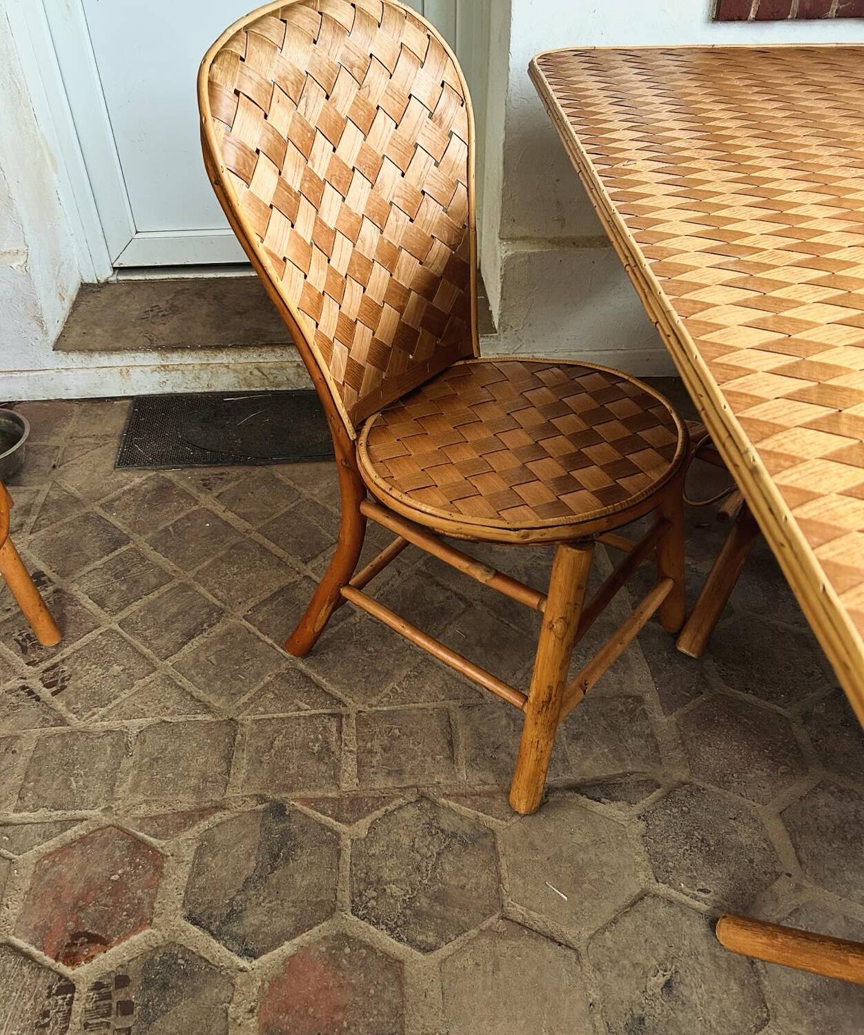 Table and chairs in woven chestnut