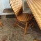 Table and chairs in woven chestnut