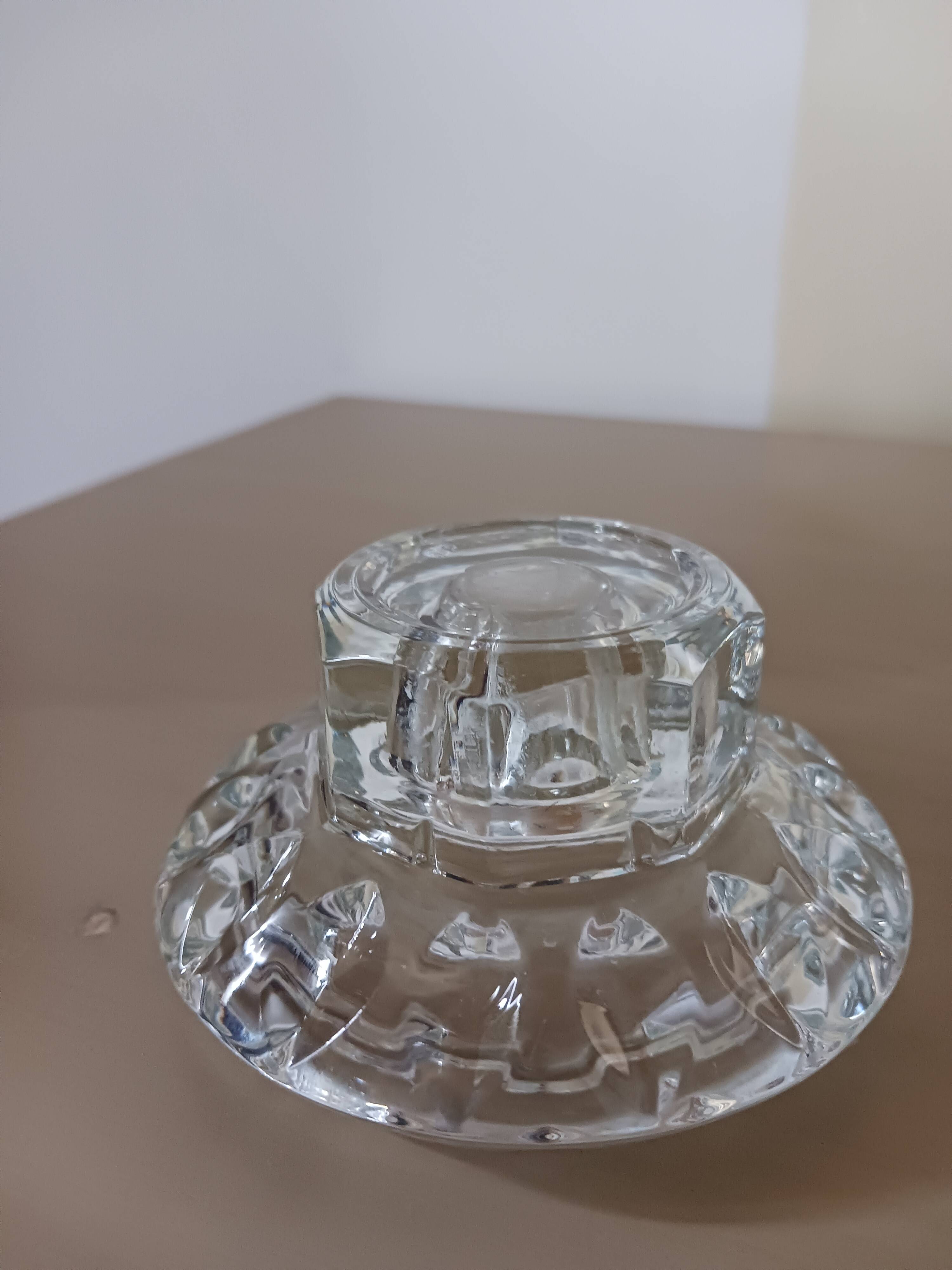 Moulded glass candle holders.