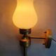 Three Empire style golden torch wall sconces