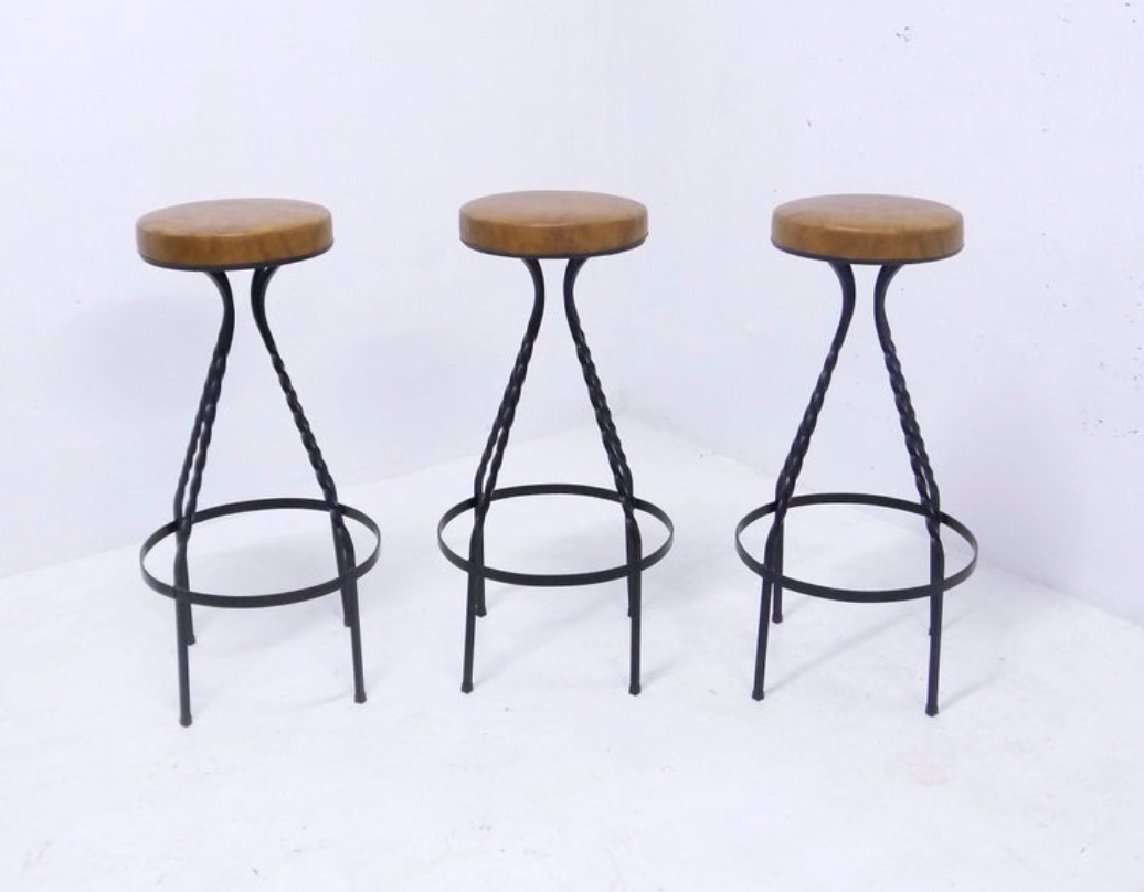 Footswith e.g. wrought iron feet and 60s vinyl seating