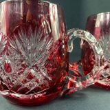 Pair of cut and red tinted crystal beer mugs signed Etzel