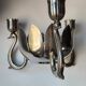 Candle holder in silver-plated metal, lotus shape.