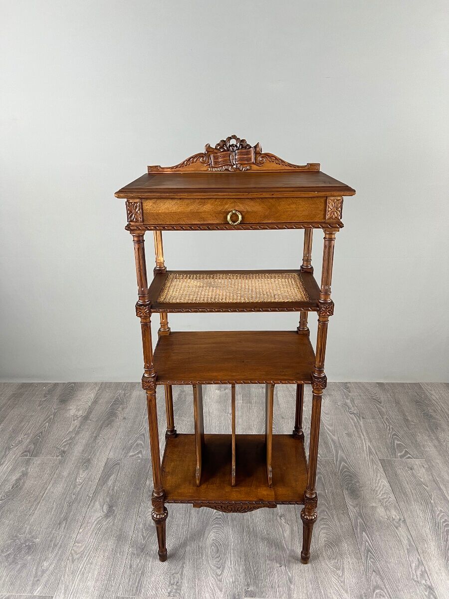 Louis XVI style music cabinet in carved wood with caning, 19th century.