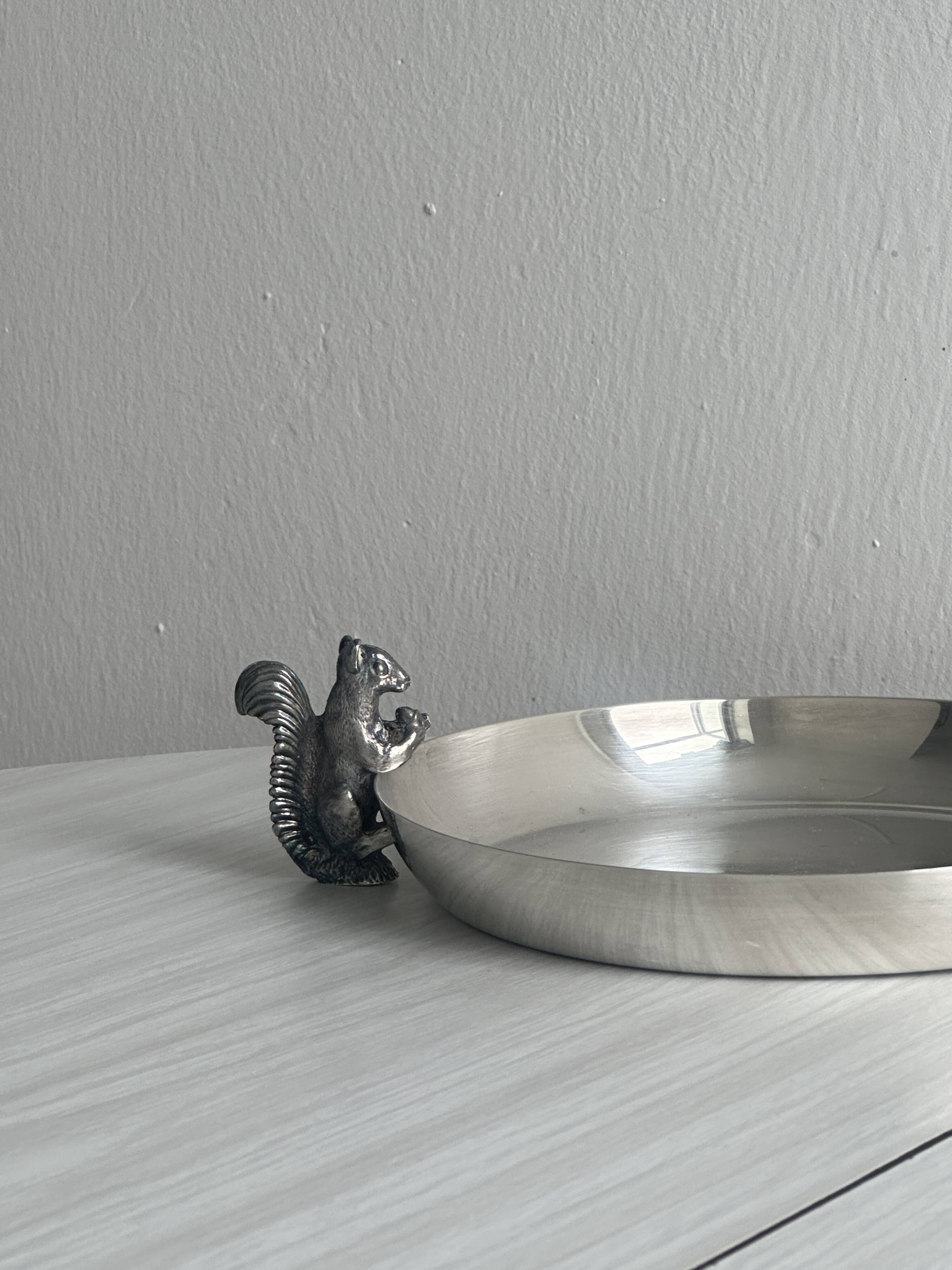 Small shiny silver metal dish