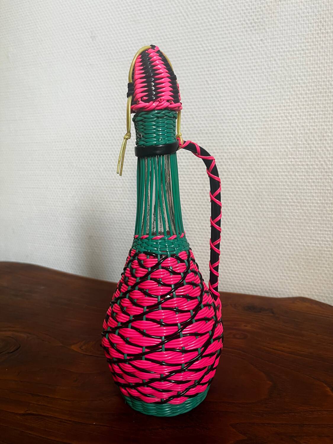 Old glass bottle and scoubidou