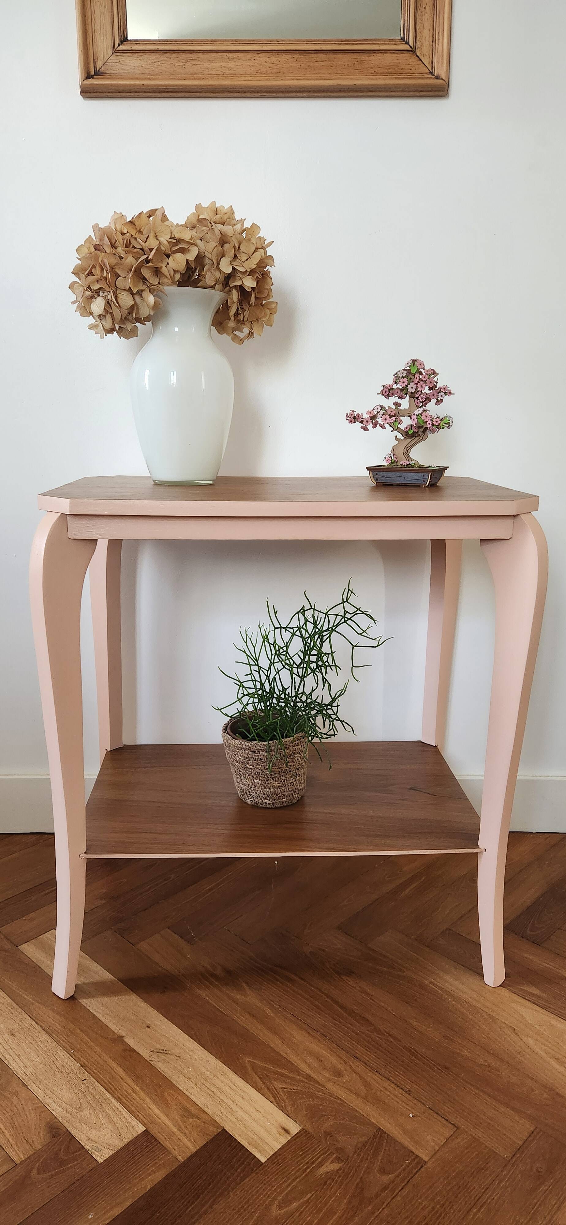 Side table with curved pink legs