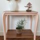 Side table with curved pink legs