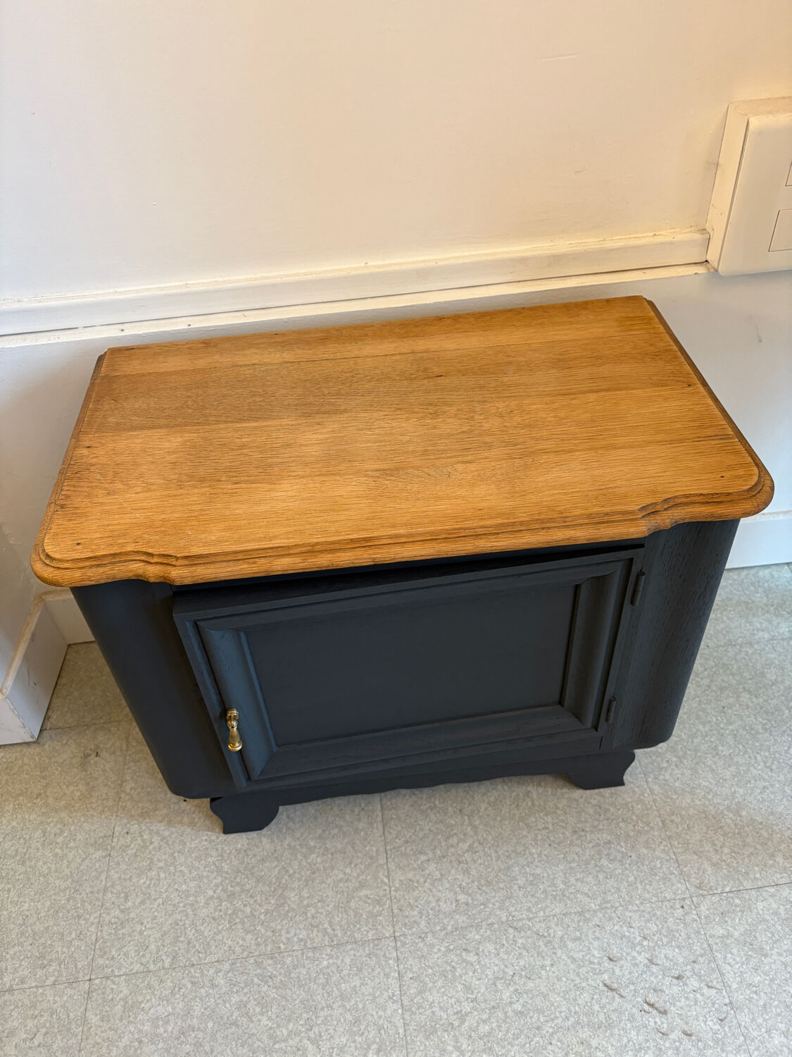 Mat black storage furniture, natural top.