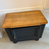 Mat black storage furniture, natural top.