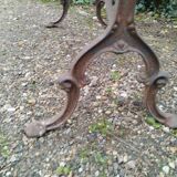 Antique bistro table with iron legs and wooden top