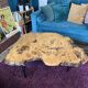 Tripod coffee table in natural solid elm magnifying glass