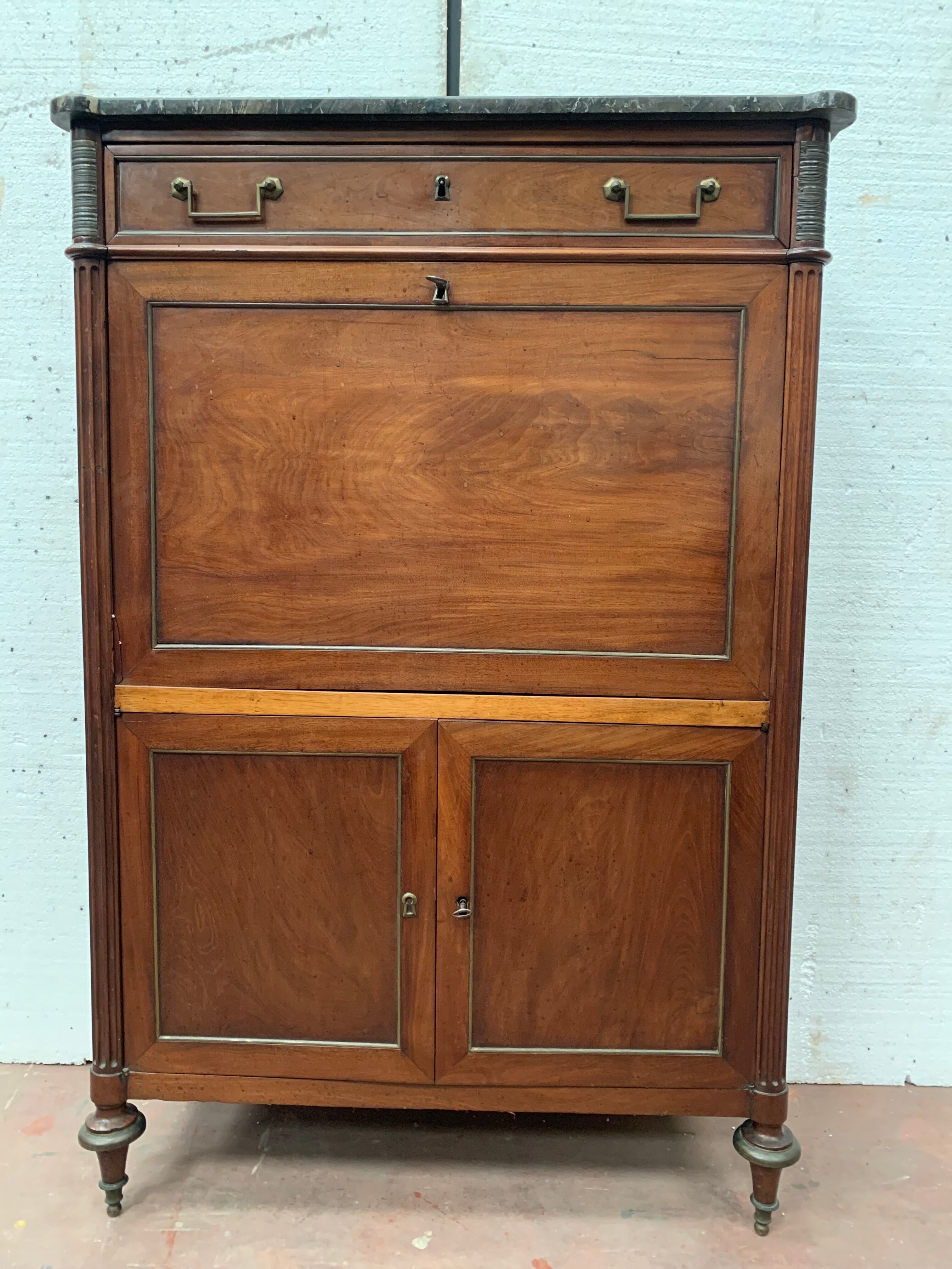 Secretary Louis XVI in mahogany Top of veined gray marble XIX century