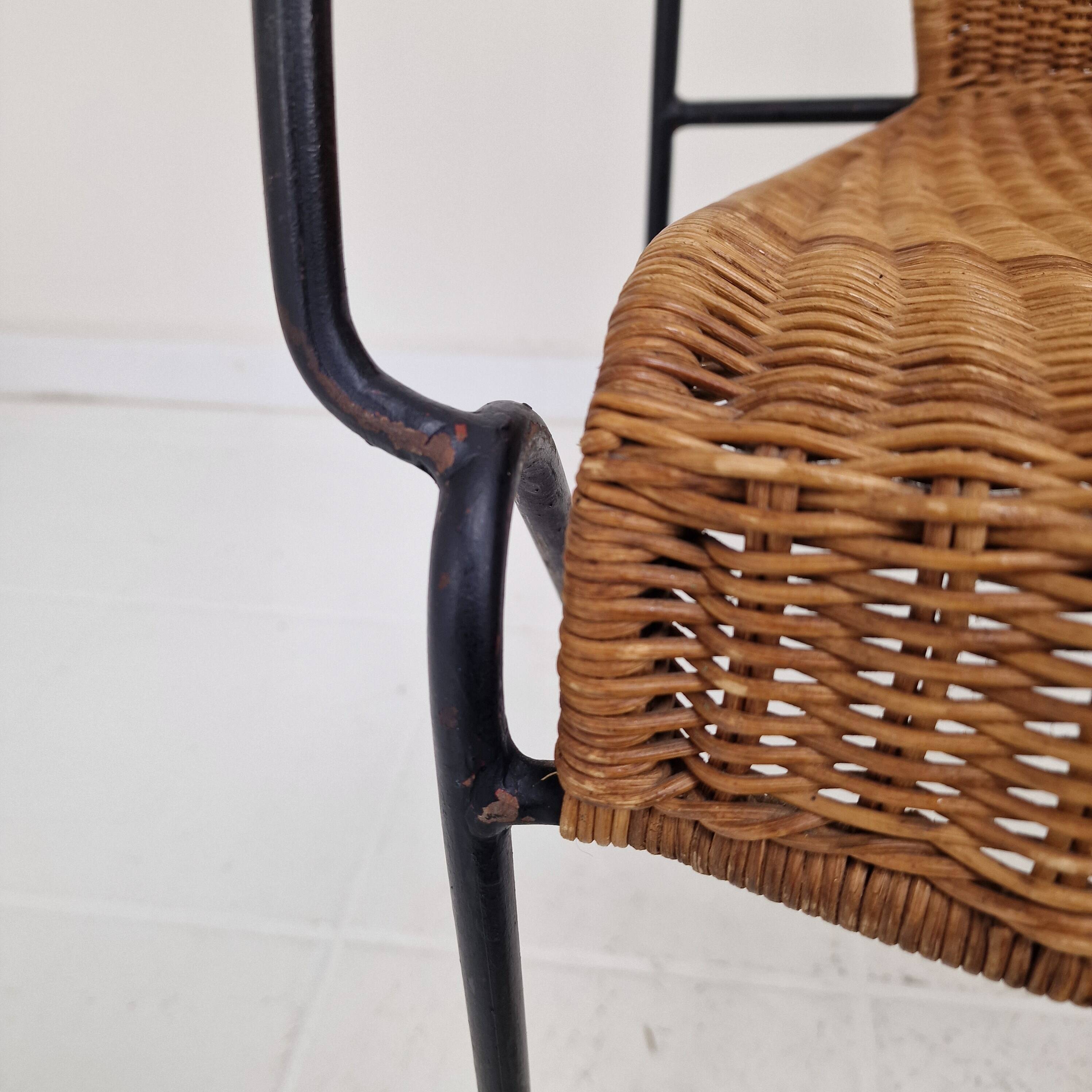 Pair of wicker and iron armchairs by Frederic Weinberg, United States, 1950s.