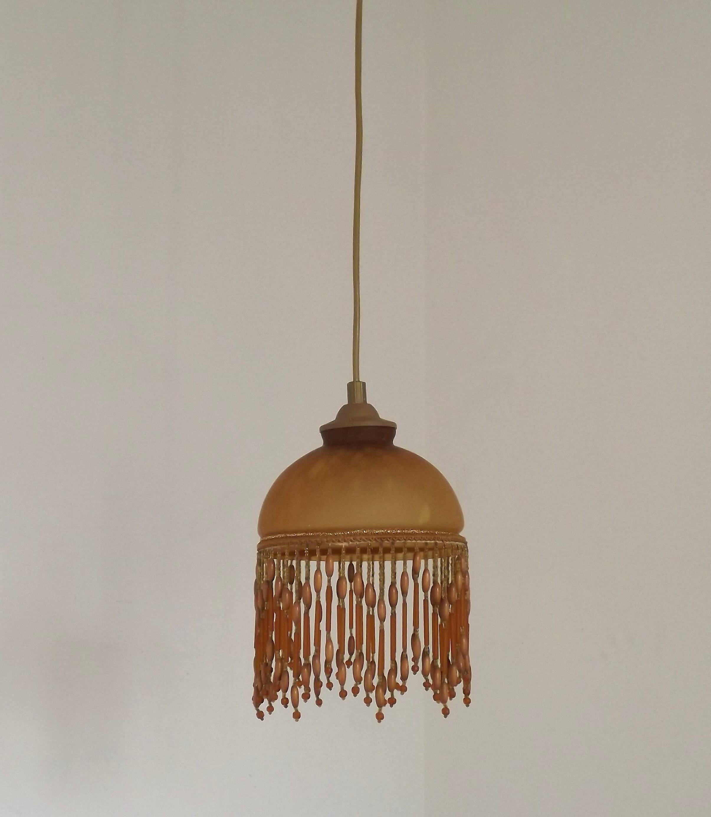 Vintage French amber mottled glass hanging ceiling light with beaded fringe.