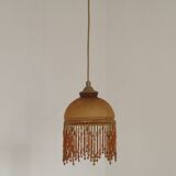 Vintage French amber mottled glass hanging ceiling light with beaded fringe.