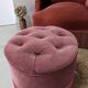Pouf or footrest in pink velvet with fringes