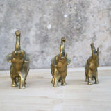 Three brass elephants