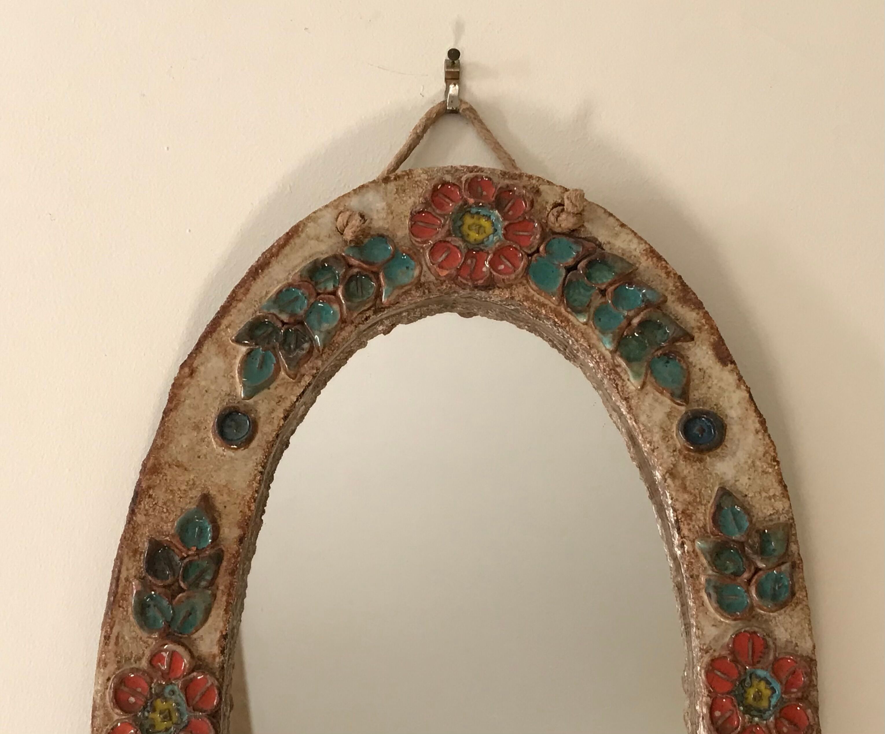 Ceramic mirror decorated with flowers, circa 1960 25x40cm