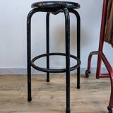 Old black industrial stool