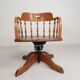 Oak office chair with a spring system and height adjustable, 1930s.