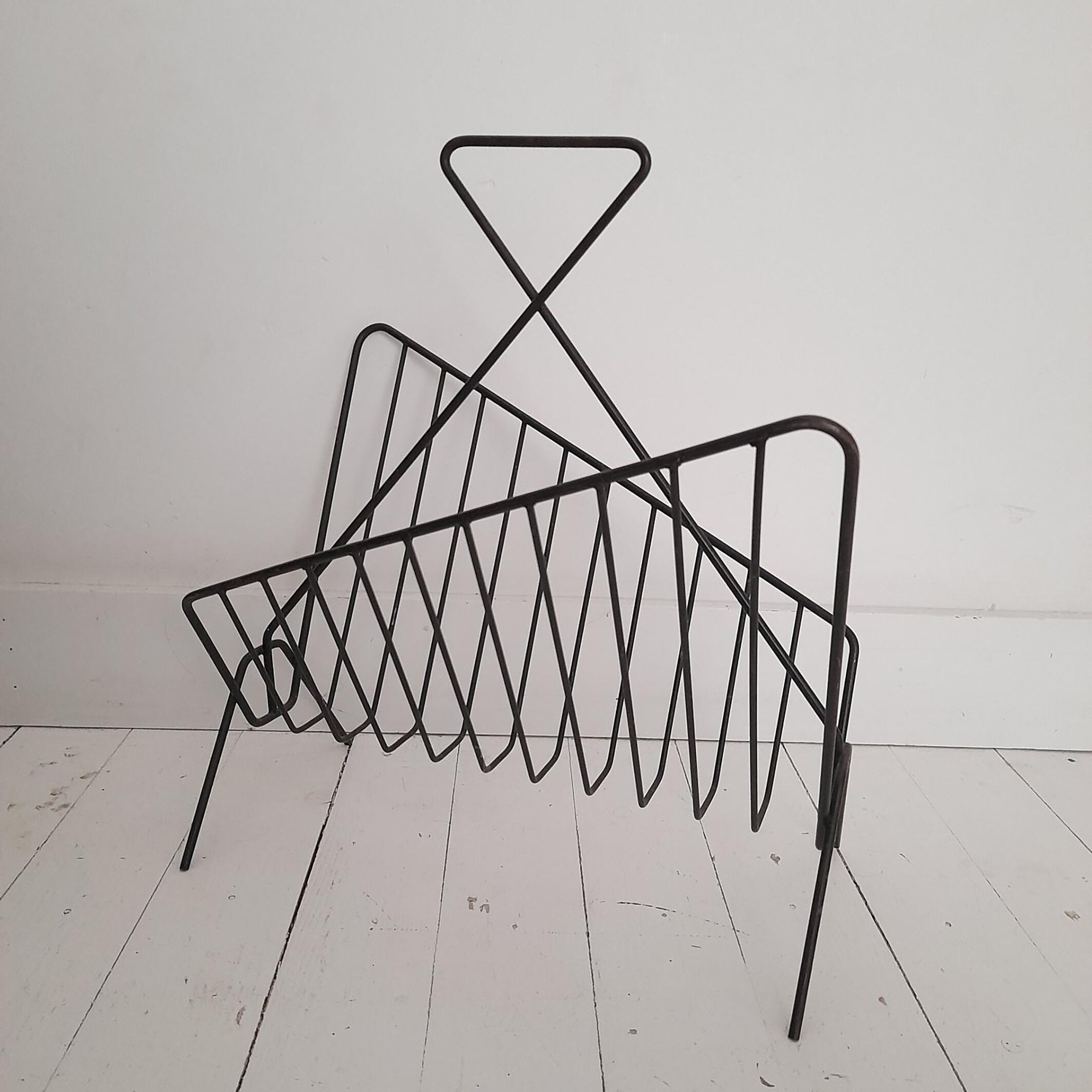 Vintage wrought iron newspaper rack from the 60s