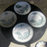 Quatre assiettes en faïence anciennes
