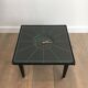 Rare small clock table in leather and brass. In the style of Jacques Adnet.