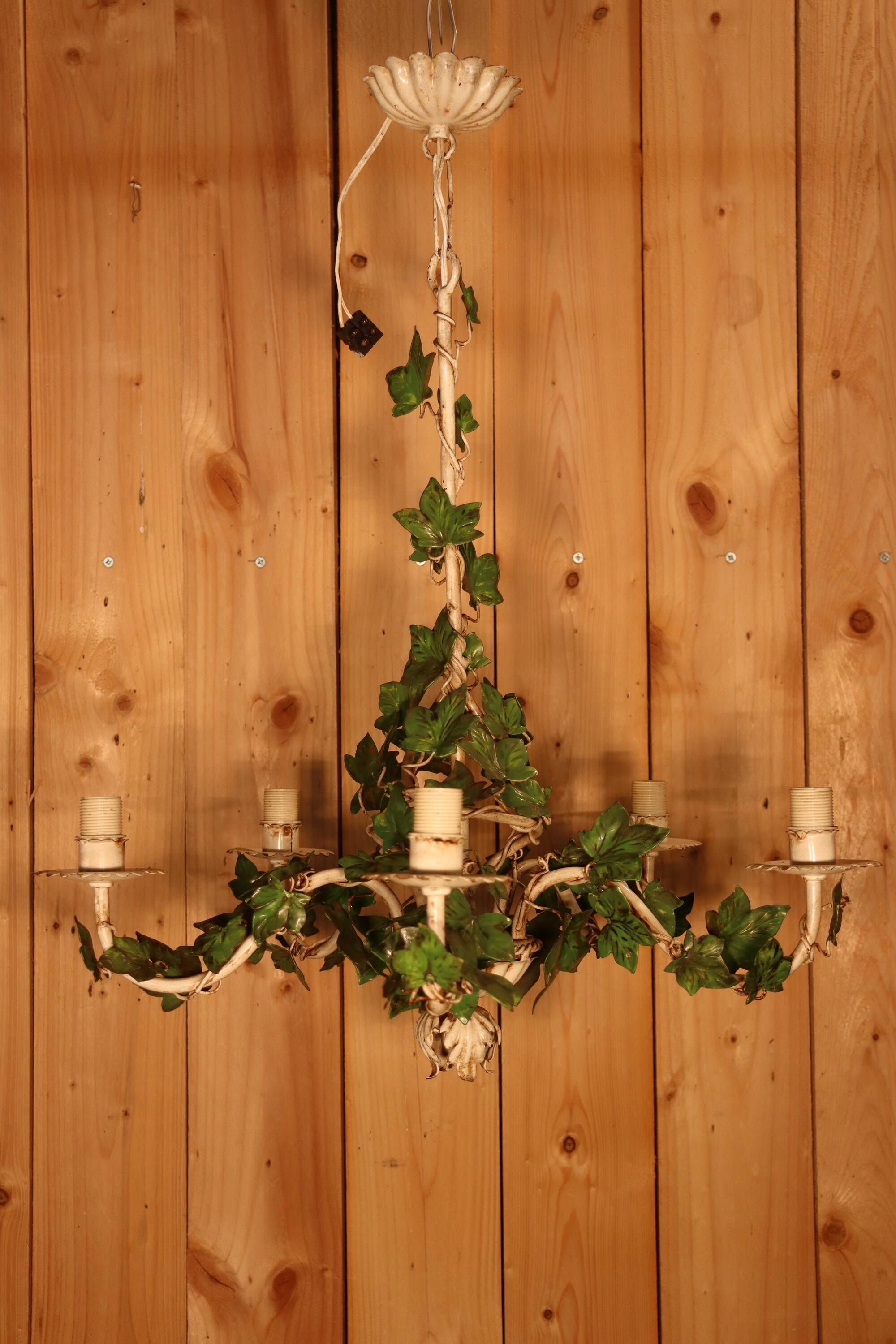 Antique metal chandelier with Art Nouveau floral decoration