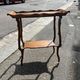 Art Nouveau period two-tiered tea table in veneered wood, signed Émile Gallé