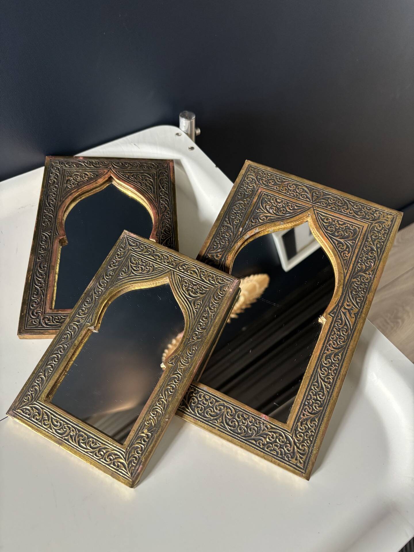 Vintage trio of mirrors in Moroccan style — embossed brass · moucharabieh arch
