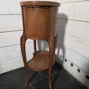 Oval bedside table in Louis XV style made of mahogany.