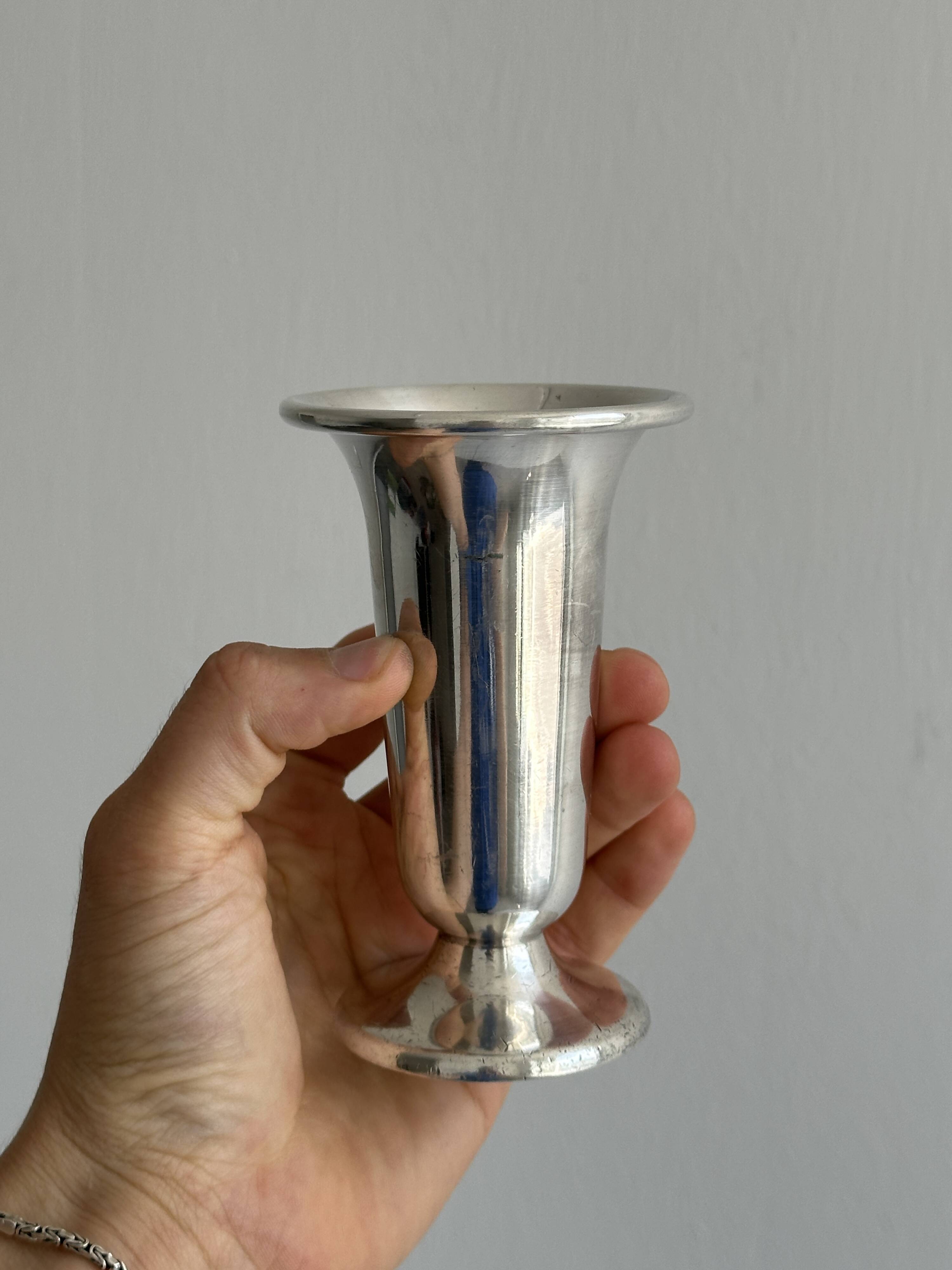 antique vase in shiny silver metal