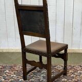 High-backed chair from the early 20th century in oak and leather