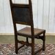 High-backed chair from the early 20th century in oak and leather