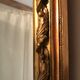 Large antique mirror with flagship shell in wood and gilded stucco