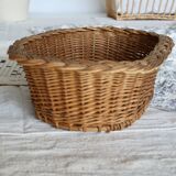 Vintage oval woven wicker basket with thick braided edge