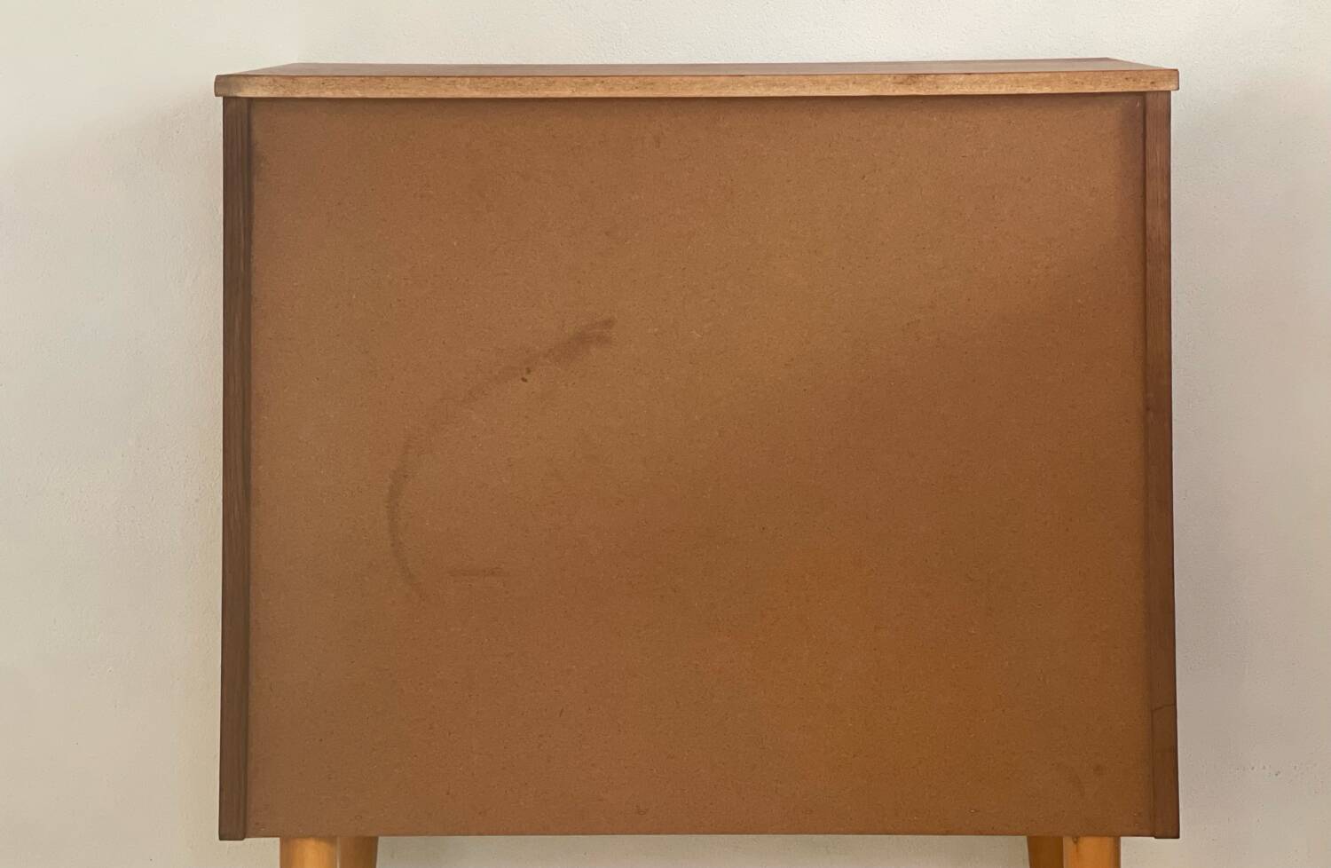 Vintage 1960s chest of drawers with covered handles.