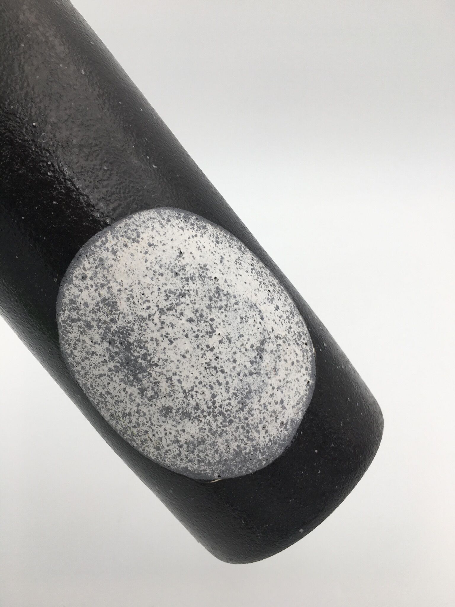 Black ceramic roll vase, decorated with a white circle, design - 20th century