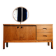 Vintage oak cabinet with circular mirror, 1960s modernist design.