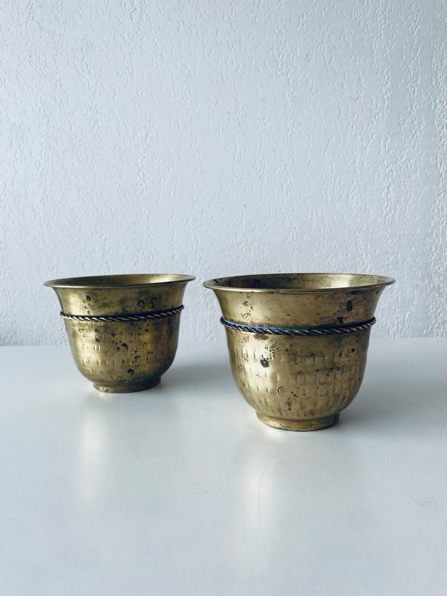 Pair of brass cord pot covers