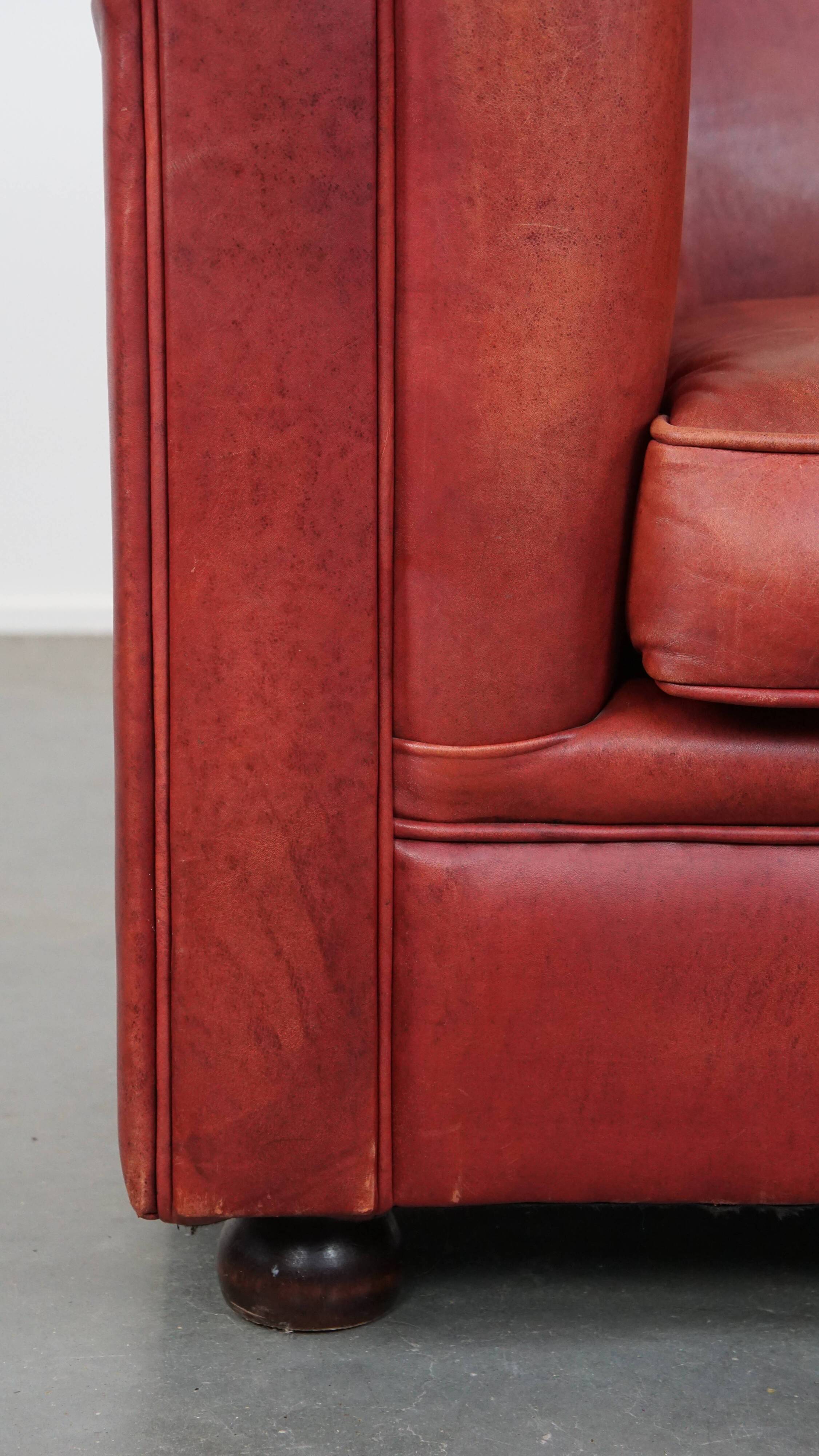 English Chesterfield club chair in light red cowhide leather