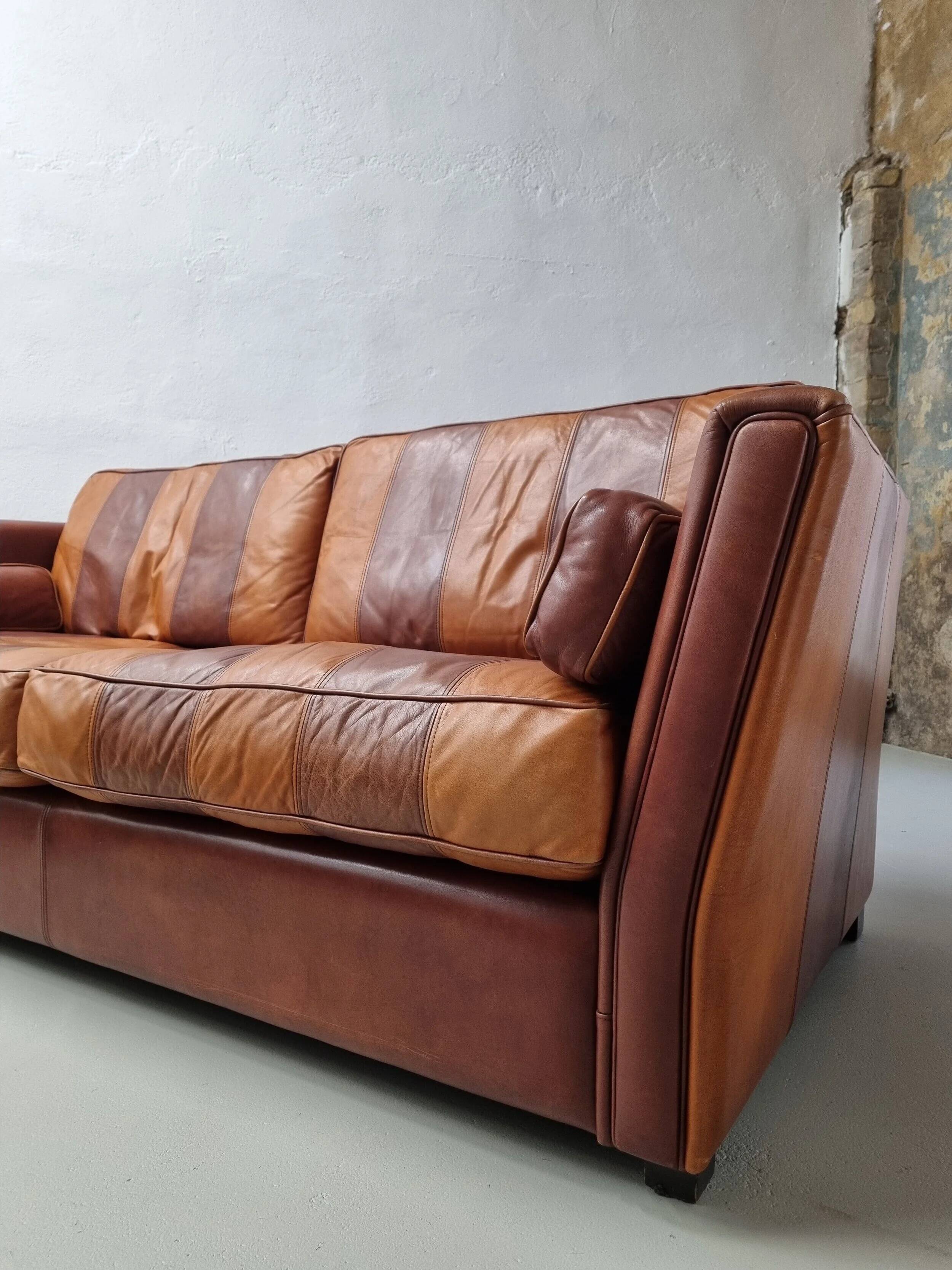 Vintage striped brown orange leather sofa (210 cm x 88 cm)
