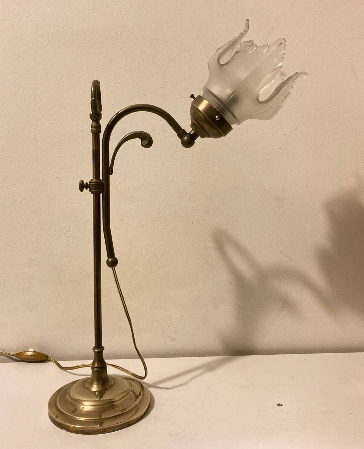 Brass table lamp with a glass shade