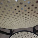 Chair in natural rattan and black metal
