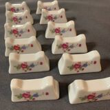 Porte couteaux x12 en porcelaine