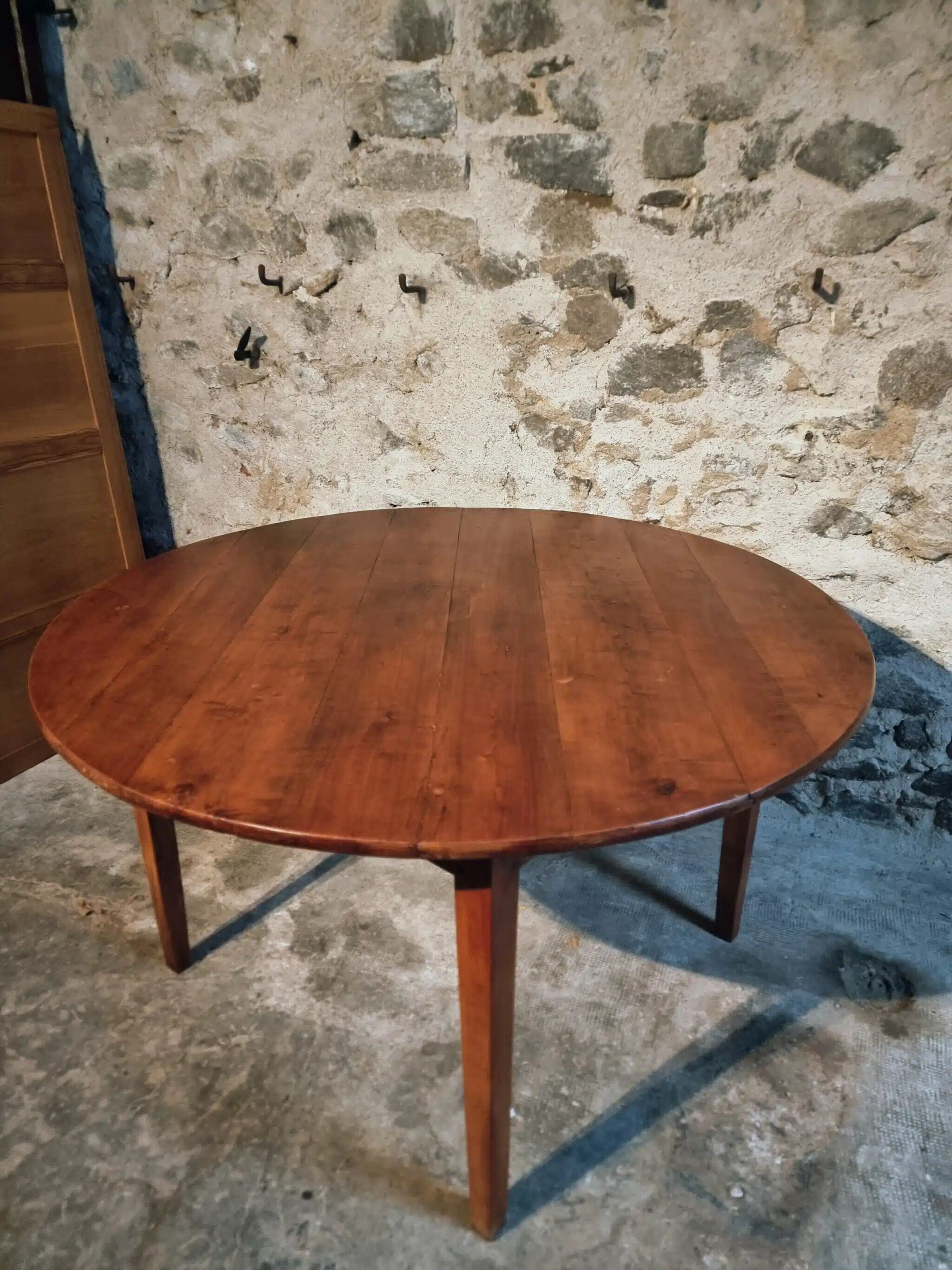 Vintage French round dining table in cherry wood, circa 1920.