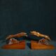 Pair of art deco wooden bookends with greyhounds